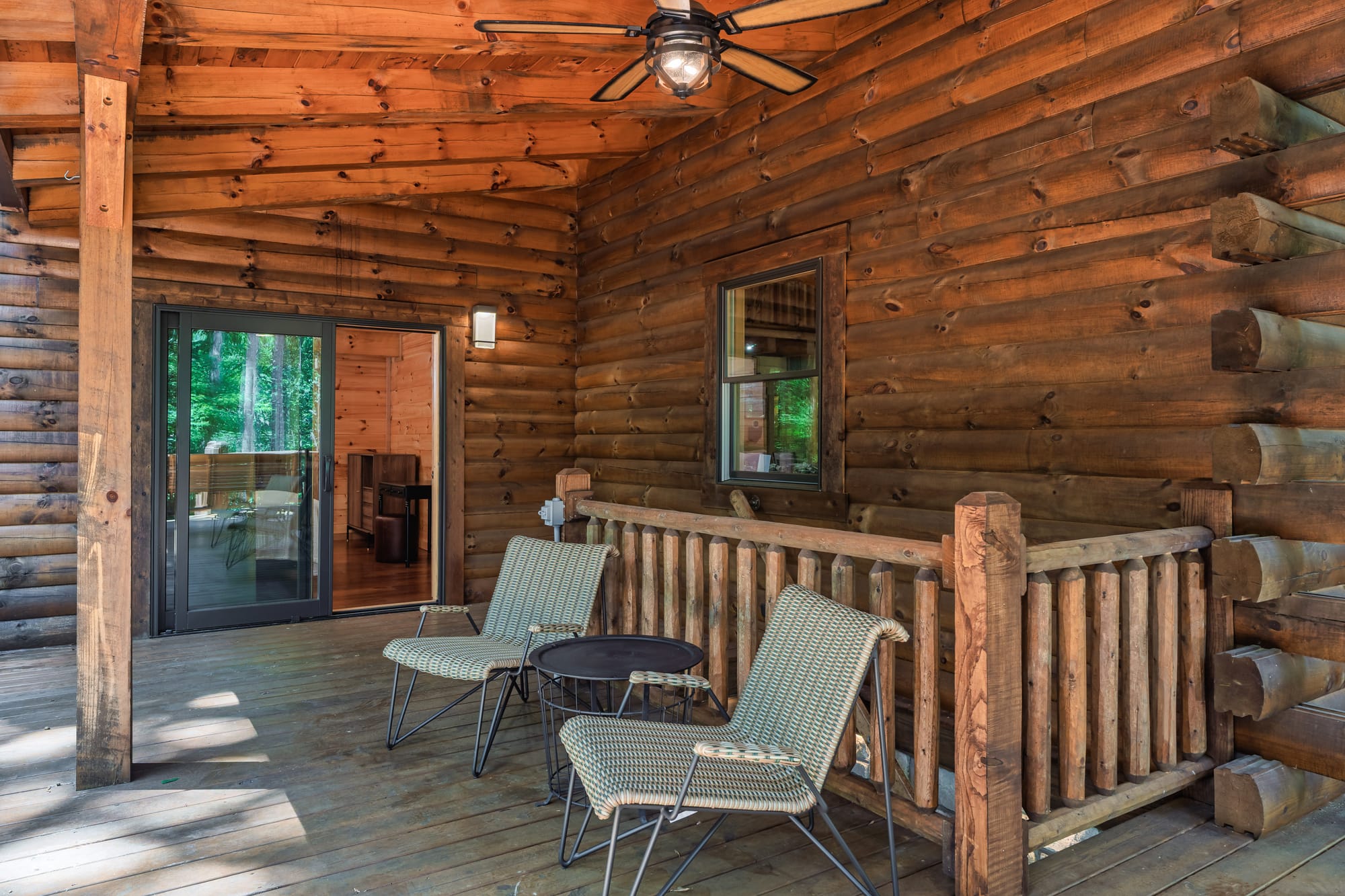 Hocking Hills luxury lodge with several seating areas on main level deck